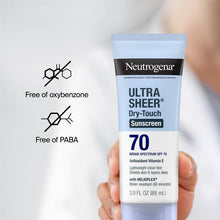 SPF 70 Dry-Touch sunscreen tube held in hand; free of oxybenzone and PABA