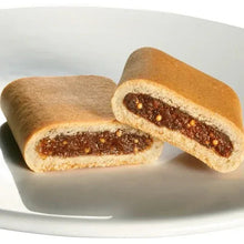 Fig cookies, whole-grain crackers with dark fig filling, shown on a white plate