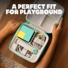 Open teal travel case with cables, small controller blocks, and phone holder