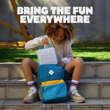 Teal kids travel backpack carrying handheld device outdoors