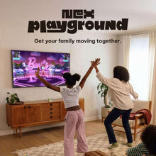 Family playing interactive fitness game on TV in living room
