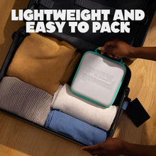 Travel case packed with cables, controller cube, and storage compartments