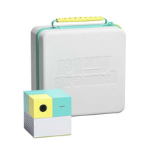 White travel case with teal trim and small yellow-blue cube device