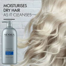 Nexxus Therappe shampoo bottle with pump beside wavy hair