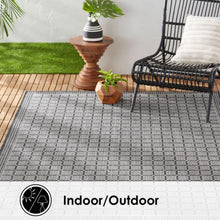 Geometric gray and dark grid area rug with repeating squares for indoor/outdoor use