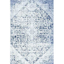 Area rug with blue-and-white distressed geometric tile pattern, solid border details