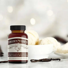 Vanilla bean paste bottle on counter with vanilla bean pod pieces, 8 fl oz