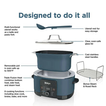 8.5-qt Ninja multi-cooker with dark pot, glass lid, steam rack and spoon