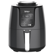 Black air fryer with digital control panel and pull-out drawer basket