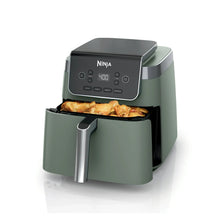 Sage air fryer with front control panel, basket open with cooked fries inside.