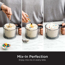 Person stirring ice cream in a pint container with a spoon