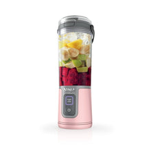Dusty pink portable personal blender with clear cup, gray lid, and start/stop buttons