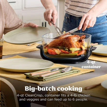 Air fryer system with glass container being loaded with roasted chicken