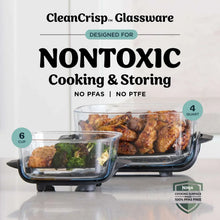 Glass cooking container placed on air fryer base with roasted food inside