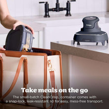 Portable air fryer base and glass container beside a brown insulated carry bag
