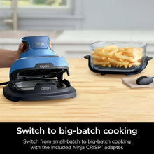 Air fryer base with snap-on adapter and glass container holding cut potatoes