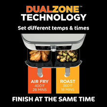 Cutaway view of dual-zone air fryer with two cooking baskets