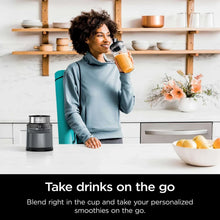 Personal blender base with clear jar and tall smoothie cup, dark gray