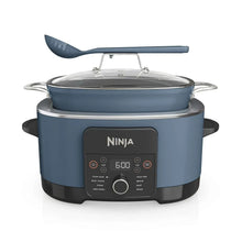 Blue multi-cooker with glass lid, utensil arm, and front control panel visible