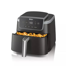 Air fryer with open nonstick basket holding fries, black control panel visible