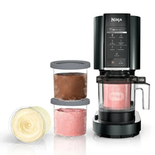 Ice cream maker with black top and clear chamber, plus two colored pint containers