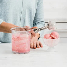 Clear freezer tub and lid with a scoop serving frozen dessert