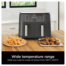 Dual-basket air fryer with front control display and two pull-out baskets, black