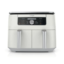 Dual-zone air fryer appliance with two stainless-steel insert handles, white body