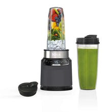 Personal blender base with clear jar, lid, and blending cup attachment in dark gray
