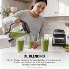 Blender pitcher pouring green smoothie into cups, stainless and black blender base