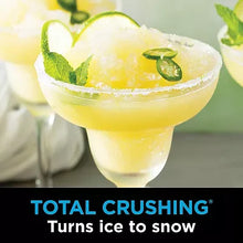 Slushy lemon drink with crushed ice and mint garnish in a glass