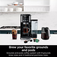 DualBrew coffee maker with pod brewer and carafe, with iced coffee cups on counter