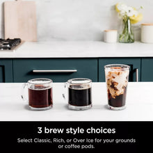DualBrew coffee maker beside three glass mugs filled with coffee