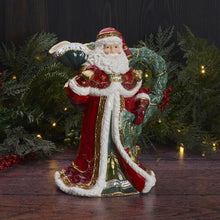 Santa holiday pitcher with red-and-white robe, green handle, and gold trim