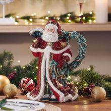 Santa holiday pitcher with white beard, red robe, and green curved handle