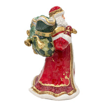 Santa holiday pitcher with red coat, white beard, green spout, and gold trim