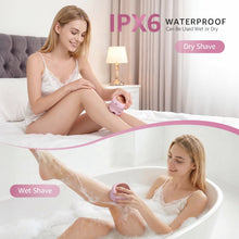 Pink waterproof electric razor being used on wet skin, circular shaving head