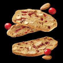Cranberry almond crisps stack with red cranberries and sliced almonds on crackers