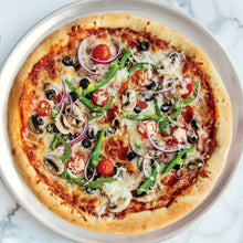 Round pizza pan with loaded pizza: mushrooms, green peppers, olives, and red pepper slices