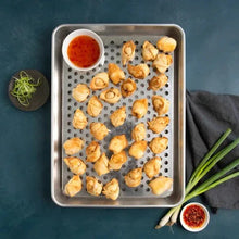 Perforated stainless steel grilling tray with bite-size snacks and dip cup