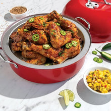 Nordic Ware red kettle smoker with lid and rack, shown with cooked chicken inside