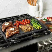 Dual-top grill griddle with grill press on stovetop, black ridged grilling surface