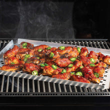 Oven crisping pan on a grill rack with saucy bacon and green onion