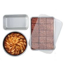 Rectangular cake pan with clear lid, natural metal finish, empty interior cavity