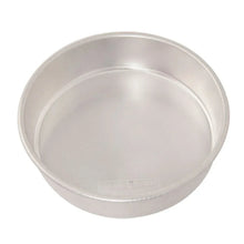 Round cake pan with light silver interior and embossed base logo