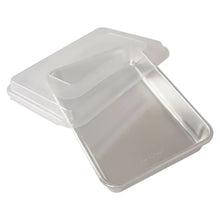 Rectangular loaf pan with clear lid, natural metal tray and transparent cover