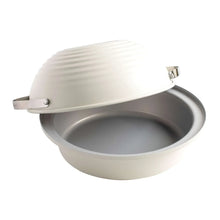 Covered sourdough baking cloche with white ridged lid, gray base, and metal latch