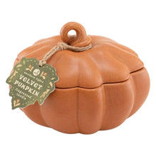 Orange ceramic pumpkin candle with hanging loop and Velvet Pumpkin label