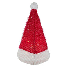 Santa hat tree topper, upright red cone with white brim and gray top, glowing clear lights