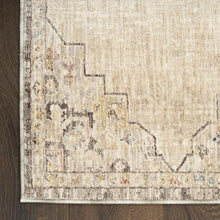 Runner rug edge detail with distressed geometric motif and muted multicolor flecks